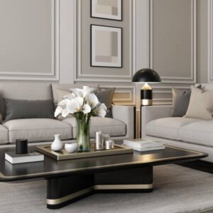 Experience the charm of modern neo-classical Parisian interior design with this luxurious living room setup. The space features classic wall molding plaster design and large classic windows that flood the room with natural light. The sophisticated beige color palette is complemented by plush pillows and sleek modern furniture. A stylish living room table with golden accents and a striking vase filled with white flowers add the finishing touches. This image is ideal for showcasing modern furniture, elegant decor, clean design, cozy room ideas, and renovation projects with a modern classic style.